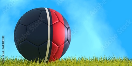 Football ball textured by New England Revolution american soccer team uniform colors. Green grass of footbal field. 3D render