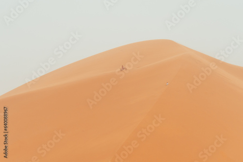 Motorbike racing through Sahara Desert  chebbi dune in Merzouga  Morocco