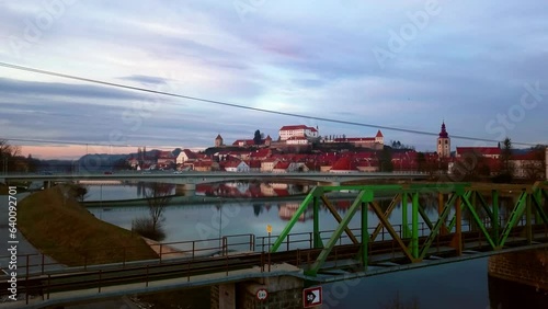 Stunning 4K drone footage of Ptuj, the oldest recorded city in Slovenia, inhabited since the late Stone Age and developed from a Roman military fort. Video captured during the enchanting blue hour. photo