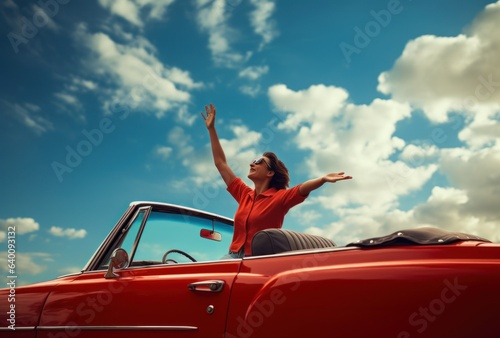 Summer Escape: Woman Reaching Skyward in Red Convertible 