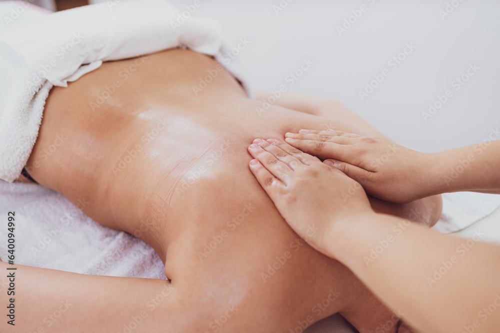 Professional female therapist massaging Professional female therapist massaging