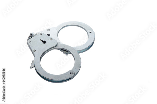 Metal handcuffs on a white isolated background, copy space