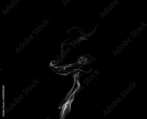 White smoke or steam smog moves on a black background. Beautiful gray smoke