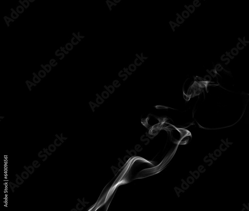 White smoke or steam smog moves on a black background. Beautiful gray smoke