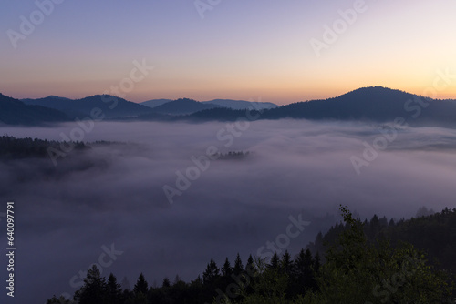 Dawn with golden morning mist in a mountain valley, Croatia © Goran