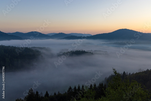 Dawn with golden morning mist in a mountain valley  Croatia
