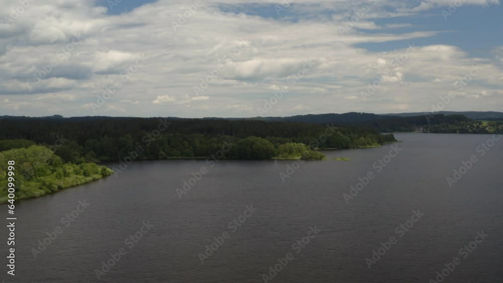 Green shore with trees along Lipno water reservoir in Czechia. Green shore with trees along Lipno water reservoir in Czechia.