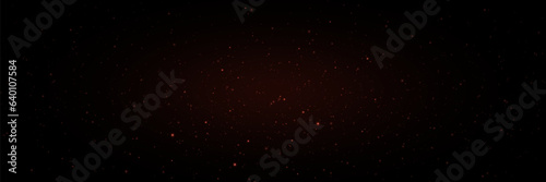 Abstract glowing glitter dust. The effect of light and shine. On a black background.