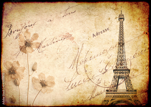 Retro background with Eiffel Tower and dry pressed flowers. Nostalgic backdrop with old vintage paper texture and inscription "Bonjour a tous" (Hello everybody) in french
