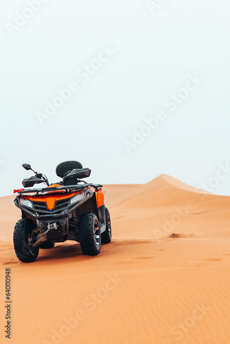 Quad bike in Sahara Desert on a cloudy day in Merzouga, Morocco
