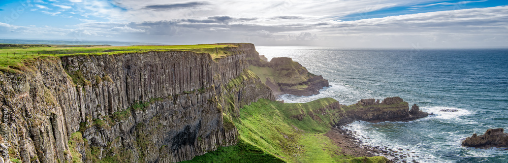 Panoramic aerilal view to seaside basalt columns rocks at Causeway Coastal Way in Northern Ireland.
