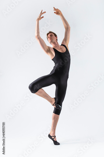 Sportive Caucasian Male Ballet Dancer Flexible Athletic Man Posing in Black Tights in Ballanced Dance Pose © danmorgan12