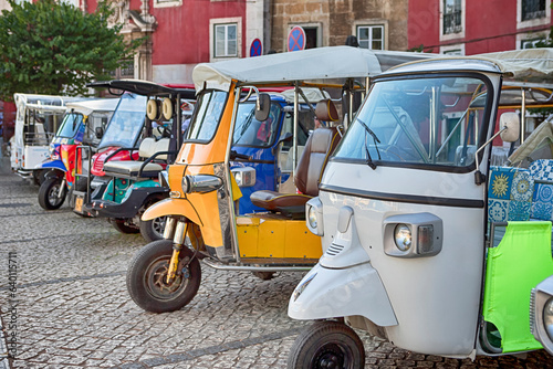 Portugal Travel Ideas. Tuk Tuk in Streets of Lisbon in Portugal as Public Mean of Transport in Open-Air City For Holidays Tourist Destinations photo