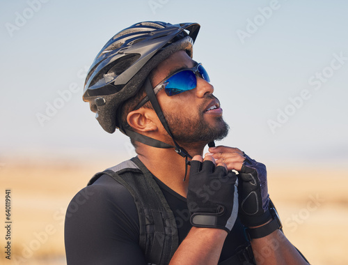 Fototapeta Naklejka Na Ścianę i Meble -  Cycling, sports and fitness with man and helmet in road for training, challenge and performance, Health, workout and wellness with person and safety gear in nature for freedom, adventure and exercise