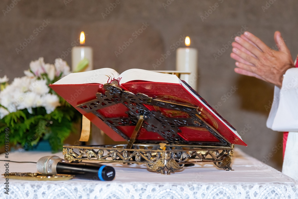 Cathoic Ritual Eucharist ceremony during mass. Catholic ritual. Priest in a white ...