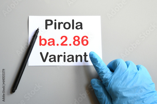 Doctor's hand indicate white sheet with text " ba.2.86 Pirola Variant". Concept of medical variety Pirola Variant and COVID-19. COVID-19 ba.2.86 Pirola Variant concept.
