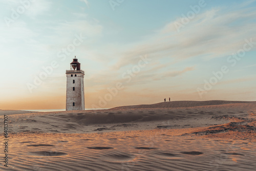 Minimalistic photo of people at sunset Rubjerg Knude Lighthouse Denmark
