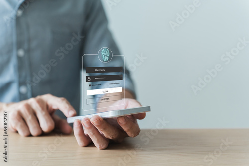 Fototapeta Naklejka Na Ścianę i Meble -  Using smartphone with fingerprint scan or biometric authentication virtual interface for user log in. Cyberspace internet technology security system. Online personal data and information protection