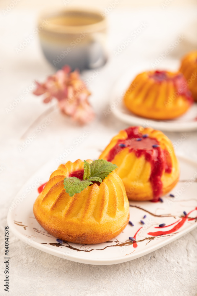 Semolina cheesecake with strawberry jam on gray concrete, side view, selective focus. Semolina cheesecake with strawberry jam on gray concrete, side view, selective focus.