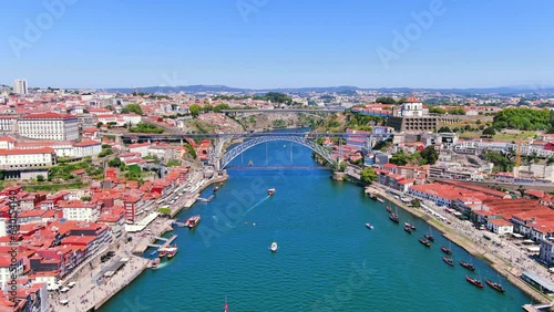 Porto, Portugal: Aerial view of famous historic European city, center with iconic Luís I Bridge (Ponte Luís I) over Douro river, Ribeira district - landscape panorama of Southern Europe from above photo
