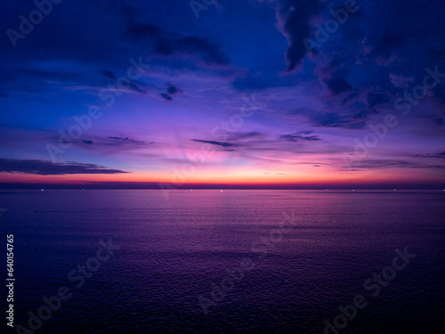Aerial view sunset sky over sea,Nature Light Sunset or sunrise over ocean,Colorful dramatic scenery sky, Amazing clouds and waves in sunset sky beautiful light nature background © panya99