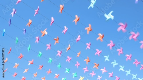 Decoration of the venue with small windmills of various colors during the New Year festival.