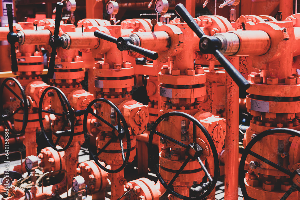 .Close-up of used flanges and welded pipes starting to rust with heavy metal fitting bolts on pipes that transport fluids to oil and gas rigs. .Close-up of used flanges and welded pipes starting to rust with heavy metal fitting bolts on pipes that transport fluids to oil and gas rigs.