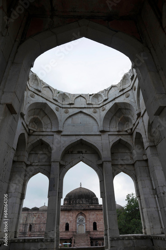Ruins and pillars of marble tomb of Asharfi Mahal or The Madarsa, built by Hoshang Shah around 14th century, located in Mandu, Madhya Pradesh, India photo