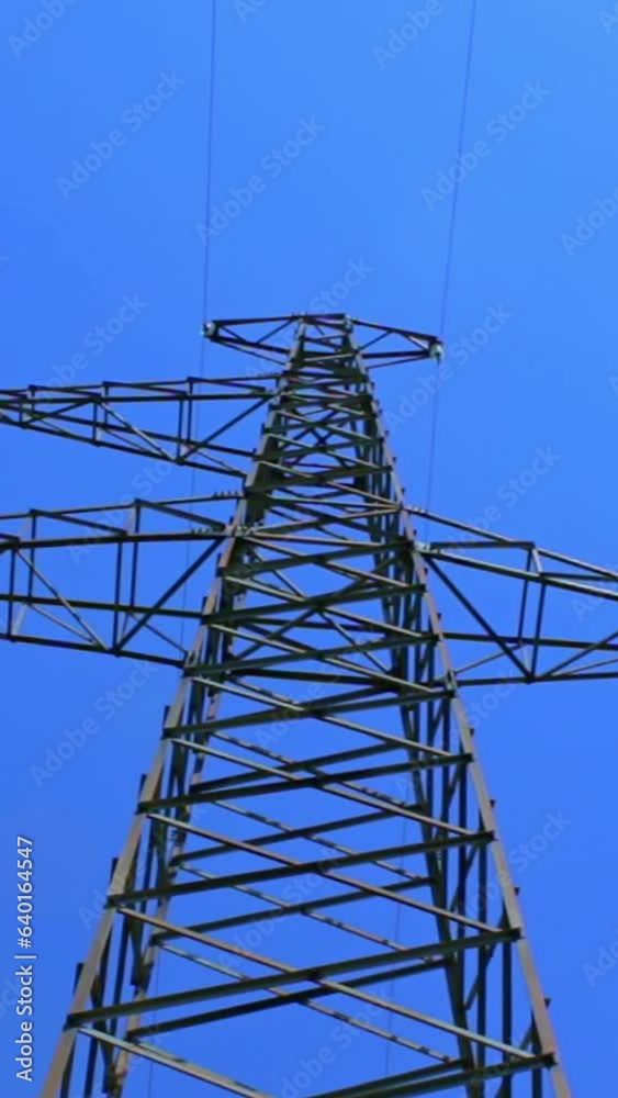 tall electric masts against cloudy sky - timelapse tall electric masts against cloudy sky - timelapse