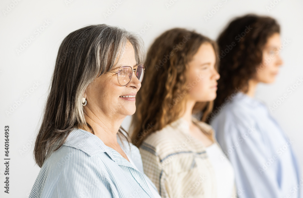Cheerful pretty caucasian teen, millennial and old women Cheerful pretty caucasian teen, millennial and old women
