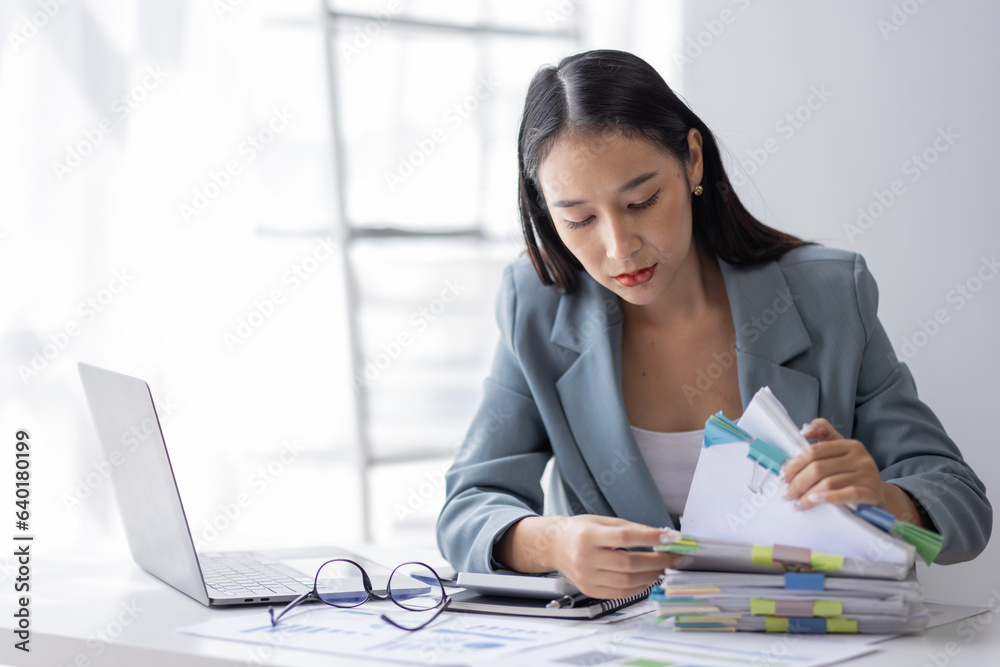 Portrait of tired young business Asian woman work with documents tax laptop computer in office. Sad, unhappy, Worried, Depression, or employee life stress concept
Portrait of tired young business Asian woman work with documents tax laptop computer in office. Sad, unhappy, Worried, Depression, or employee life stress concept