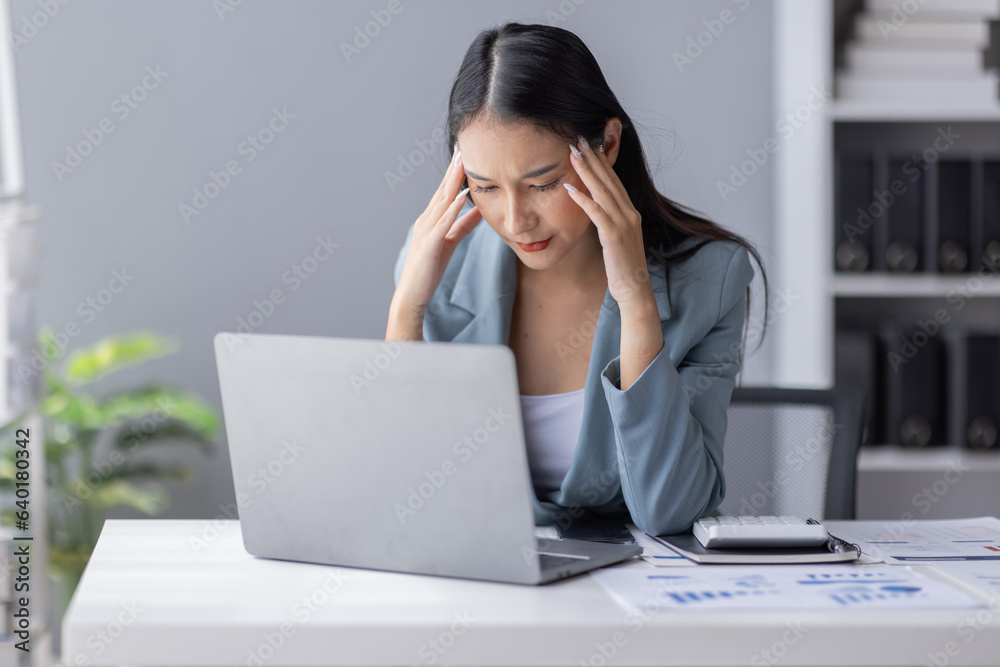 Portrait of tired young business Asian woman work with documents tax laptop computer in office. Sad, unhappy, Worried, Depression, or employee life stress concept
Portrait of tired young business Asian woman work with documents tax laptop computer in office. Sad, unhappy, Worried, Depression, or employee life stress concept