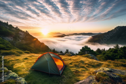 A fantastic view of the sunrise and the sea of clouds from the tent set up on the top of the mountain. Lifestyle concept for holidays and vacations.
