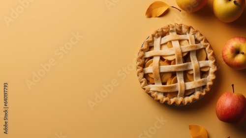 Apple pie with apples on solid color background 