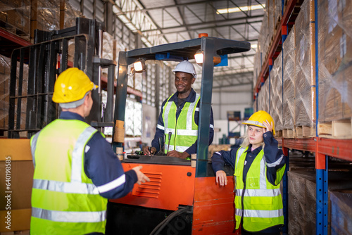 Worker industry factory wear safety uniform factory drive forklift truck moving goods boxes to industry production in factory warehouse area is industry manufacturing transportation concept.