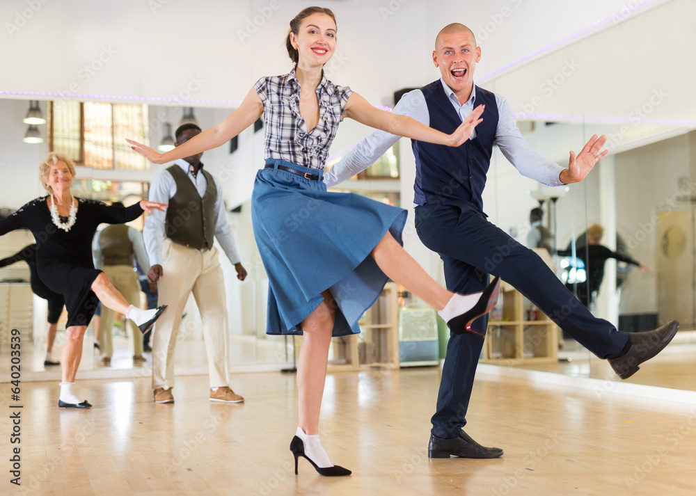 Fototapeta premium Adult dancing couple enjoying active swing