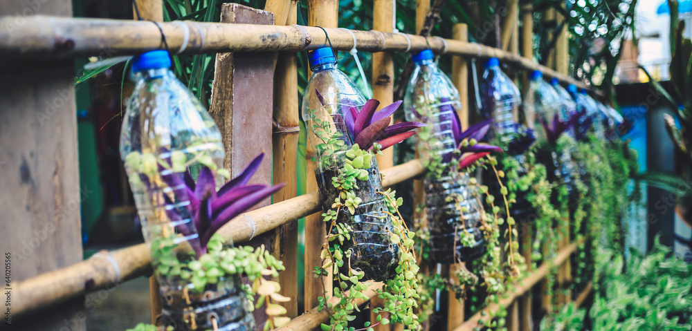 Creative ideas for making plant holders from recycled plastic bottles. These can be used to decorate your garden or home while reducing packaging waste.