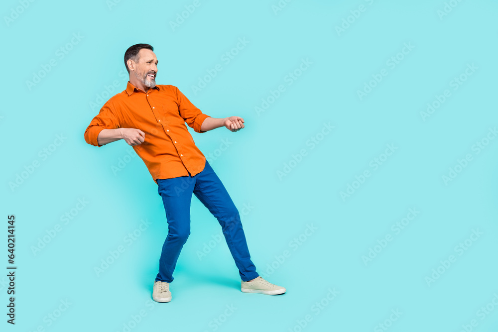 Full length photo of senior businessman pull empty space success achieve progress object determination isolated on blue color background Full length photo of senior businessman pull empty space success achieve progress object determination isolated on blue color background