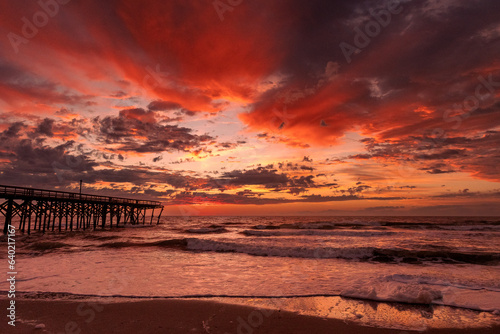 Sunrise over the Pawley's Island fishing Pier one week after half the pier was washed out to sea by Hurricane Ian © John McAdorey