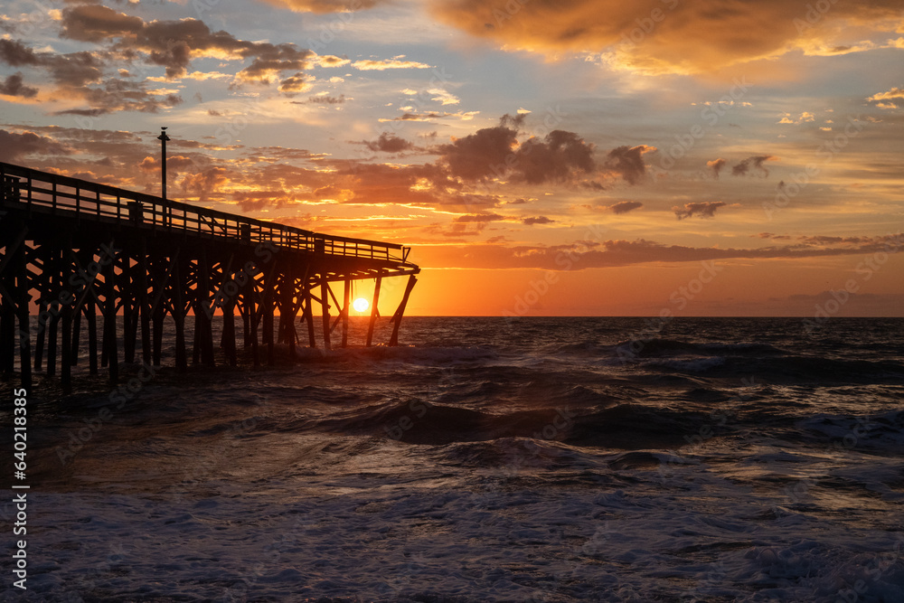  Sunrise over the Pawley's Island fishing Pier one week after half the pier was destroyed by Hurricane Ian