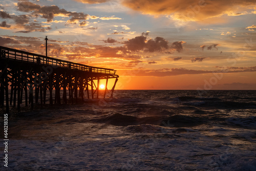  Sunrise over the Pawley's Island fishing Pier one week after half the pier was destroyed by Hurricane Ian