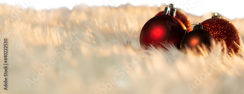 Digital png photo of red christmas ornaments on white carpet on transparent background