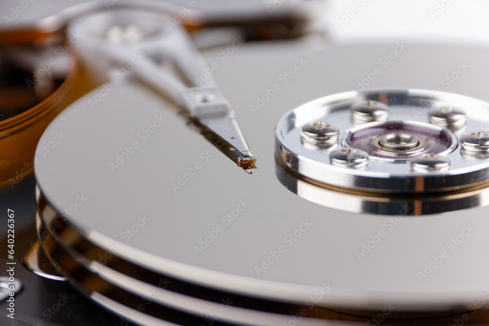 hard drive and magnifying glass, representing the process of searching and saving data hard drive and magnifying glass, representing the process of searching and saving data
