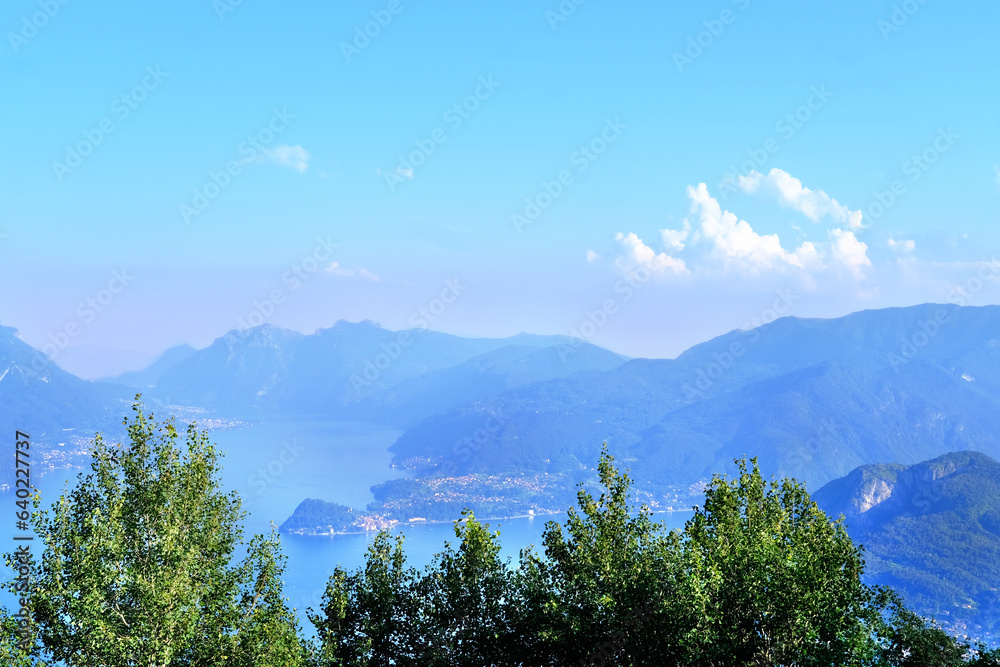 aerial view of Como Lake landscape in beautiful summer day, trees, water and mountains, Italy, Europe, concept summer vacation, travel and enjoyment