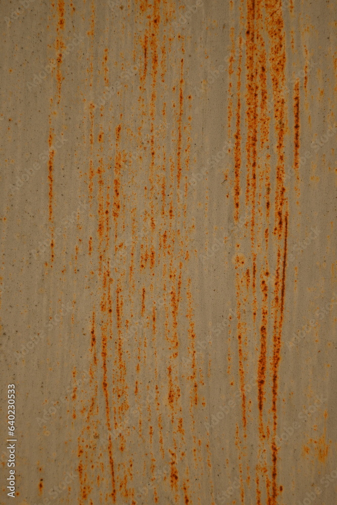 Orange rusty surface of old iron. Corroded metal background. Rusted white painted metal wall. Rusty metal background with streaks of rust. Rust stains. The metal surface rusted spots. Orange rusty surface of old iron. Corroded metal background. Rusted white painted metal wall. Rusty metal background with streaks of rust. Rust stains. The metal surface rusted spots.