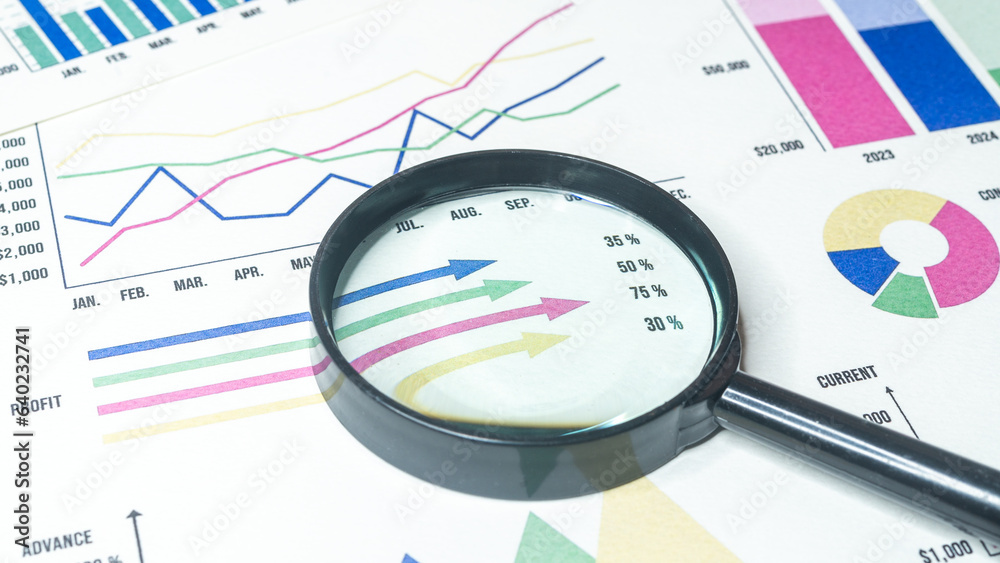 Magnifying with Business Graphs finance document. Magnifying with Business Graphs finance document.