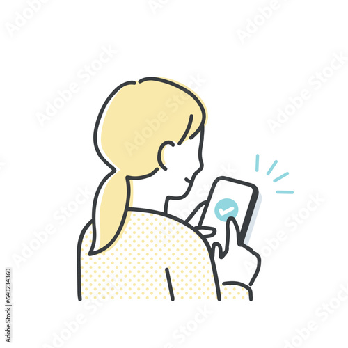 スマホを操作する若い女性