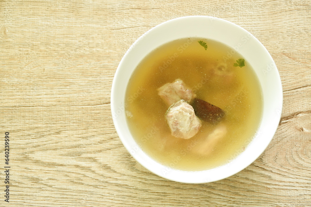 boiled chop braised pork bone with black mushroom in Chinese herb soup on bowl boiled chop braised pork bone with black mushroom in Chinese herb soup on bowl
