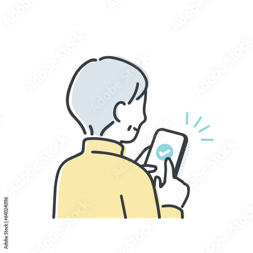 スマホを操作するシニア女性