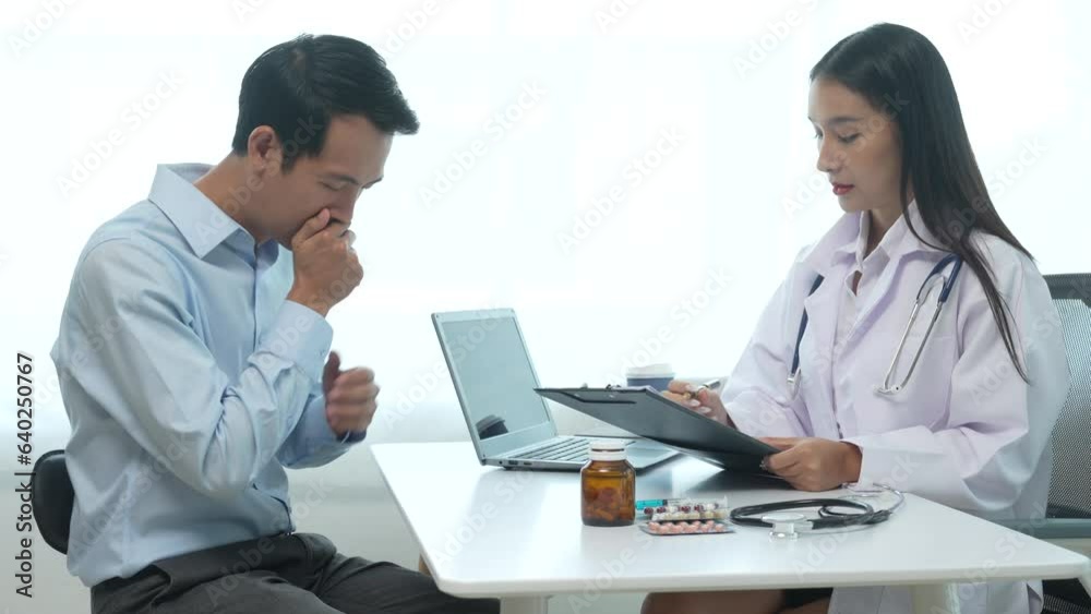 4k slow motion of asian female doctor specialist and male patient discussing Flu (influenza) is infection of nose, throat, lungs, respiratory system. head, body aches, sore throat, fever, respiratory 4k slow motion of asian female doctor specialist and male patient discussing Flu (influenza) is infection of nose, throat, lungs, respiratory system. head, body aches, sore throat, fever, respiratory